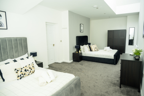 Relax in this well-lit two-single bedroom, designed for comfort and rest.