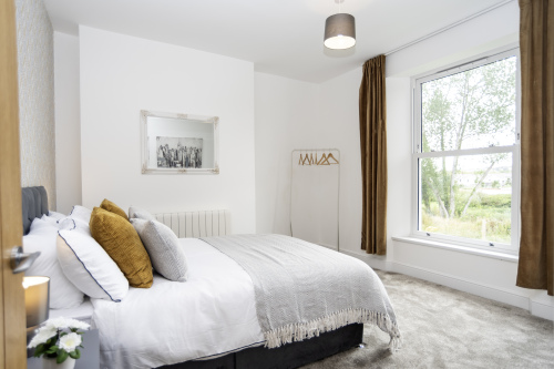 Bright & Comfortable Bedroom — Double bed, elegant décor, bedside lighting, mirror, hangers and hairdryer for a convenient long stay