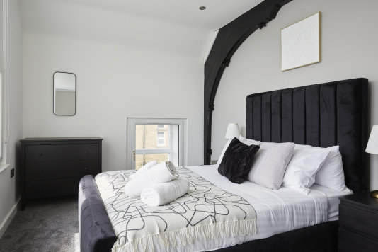 Your private retreat: a stylish double bedroom with a calm, welcoming feel.