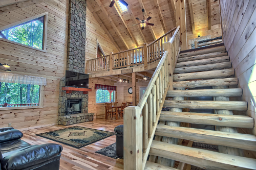 Log Staircase, leading to Loft Level, with Great Room to left
