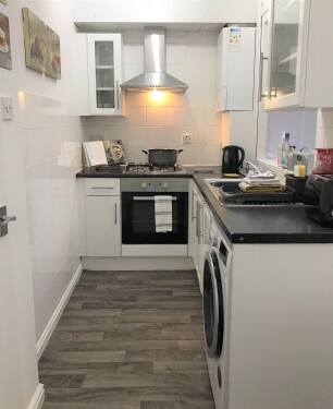 Kitchen - Fully equipped kitchen with fan oven, gas hob, microwave, fridge freezer and washer dryer.