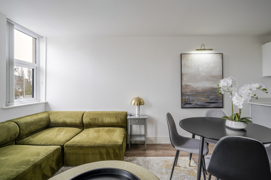 Experience refined comfort in this beautifully designed living room, where sophisticated décor meets effortless elegance. Flooded with natural light, the space features plush seating, stylish accents, and a statement centrepiece that elevates every moment. Perfect for relaxing or entertaining, this room delivers luxury living at its finest.