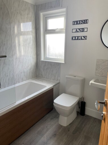 Smart family bathroom with powerful shower over bath.