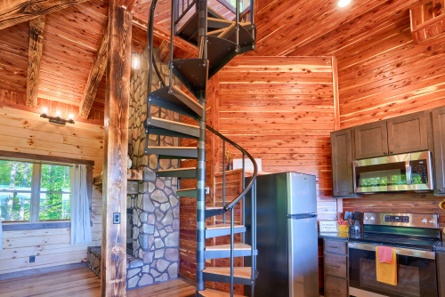 Spiral Staircase and Kitchen, Soaring Eagle Luxury Treehouse