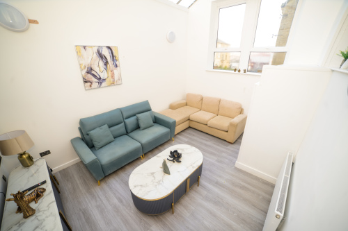 Spacious living room ideal for lounging, socialising, or enjoying a quiet evening.