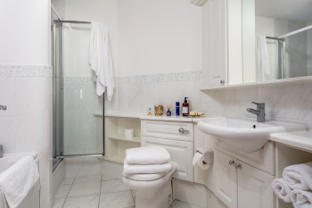 Fully fitted en suite in all Turnberry apartments. Walk in shower with small step and separate bath. 