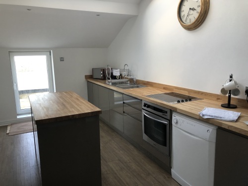 Kitchen leading to balcony