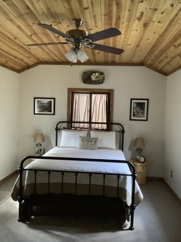 The private bedroom has a comfy queen-sized bed, dressers and all linens are provided.