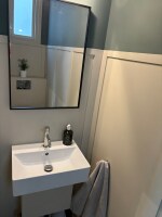 Woodside Cottage - Ground floor toilet from utility room which has bootroom area for hanging coats, washer and dryer and storage for cleaning items. 