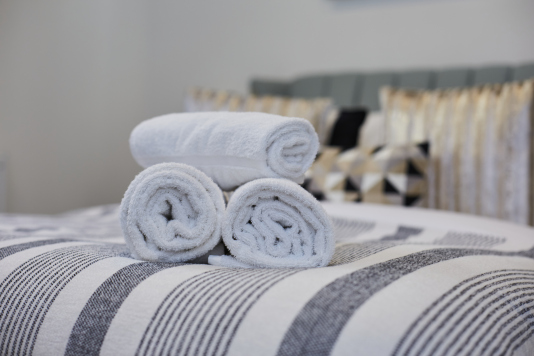 Your private retreat: a stylish double bedroom with a calm, welcoming feel.