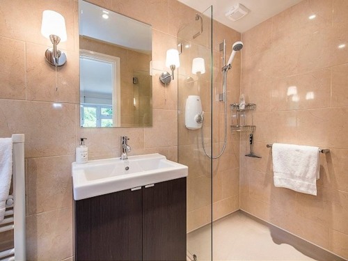 Super King room ensuite with heated floor and towel rail.