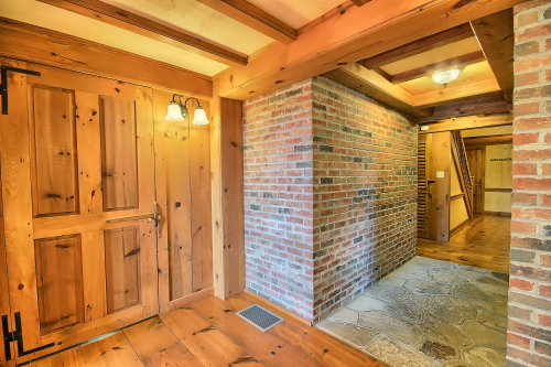 Brick Hallway and Door to Private Bedroom 1