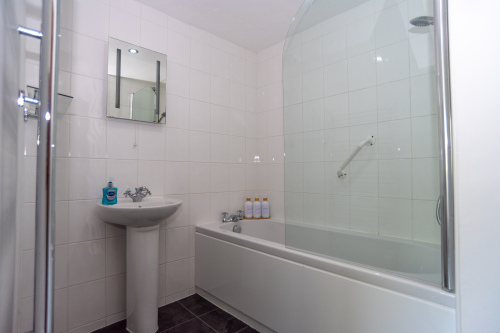 A proper soak in the bath, or a quick rinse under the shower - your choice. One of three bathrooms within The Farmhouse