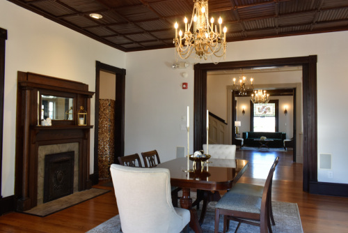 Dining room with original hardwood floors & fireplace