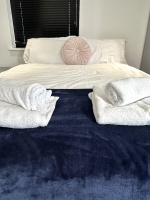 Beautiful large bedroom with stunning natural light, gorgeous artwork, smart TV, desk with comfy chairs, lamp, wardrobe, chest of draws and everything else you need for a perfect stay!