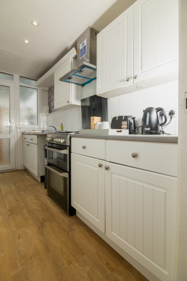 Kitchen with utensils, toaster, kettle, oven