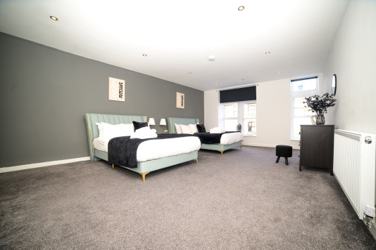 Relax and unwind in this cosy double bedroom, designed for a peaceful night’s sleep.