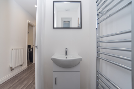 Convenient downstairs WC offering added privacy and easy access for guests during their stay.