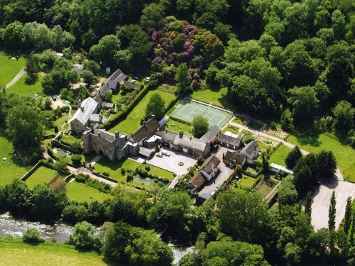 An aerial view of the Castle, Cottages, Gardens and the River Exe