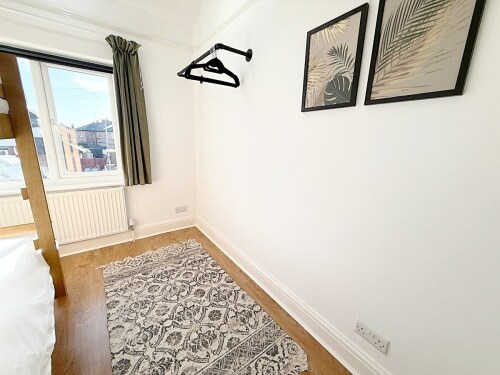 This charming bedroom features a cozy bunk bed, perfect for children. With vibrant décor and a playful atmosphere, it’s the ideal space for little ones to relax and recharge.