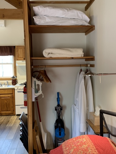 Closet (extra pillows, extra blanket, robes, iron, hangers, vacuum, stool