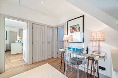 uxury kitchen featuring a striking black sink with gold detailing.