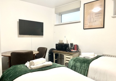 In each room: Microwave, plates, bowls, cutlery, tea, coffee, sugar, biscuits, kettle, mugs, drinking glasses