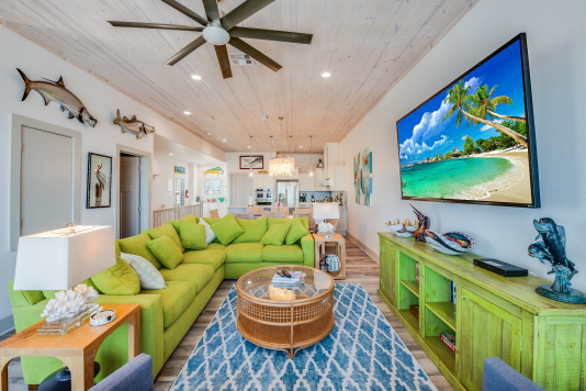 Living room has 6-person sectional and two recliners