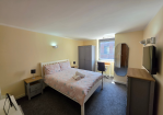 This comfortable double bedroom has been thoughtfully designed for both relaxation and productivity, featuring a Smart TV, dedicated workstation, and a selection of books and reading material. Whether you're travelling for business, enjoying a city break, or staying longer-term, you'll find everything you need for a comfortable and enjoyable stay.