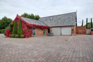Parking in front of the garage, there is also parking sports to the left hand side of the property