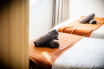 Fresh bath towels placed on beds for your comfort.