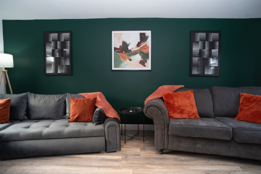 Enjoy our stylish and comfortable living room, featuring dual sofas — one converting into a double sofa bed, fully dressed with fresh linens for your stay.