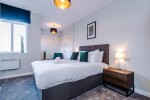 Comfortable bedroom with a king-size zip and link bed that can be separated into two singles upon request.