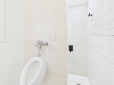 A polished, modern bath with sleek fixtures and unexpected details.