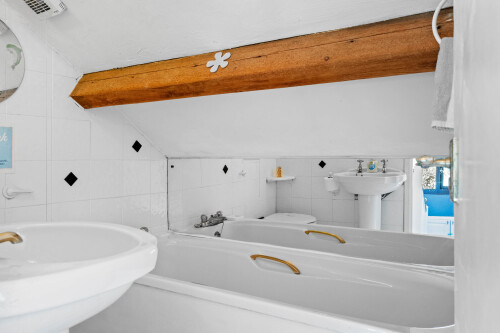 Top Floor Bathroom ,note restricted head room