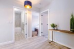 A welcoming corridor providing access to all rooms within the property.