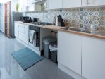 Brand new kitchen with utensils, new washing machine, fridge, microwave, oven, kettle, toaster, coffee, tea, sugar, milk