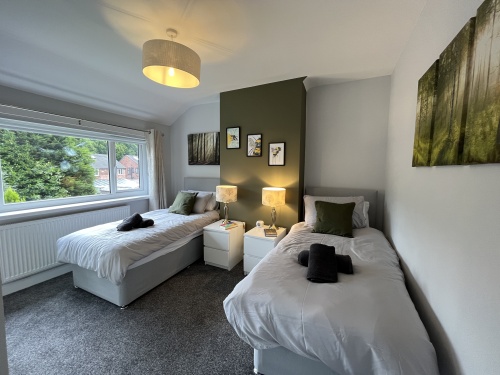 Bedroom one - Two comfy single beds, wardrobe and Smart TV for streaming