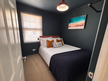 Second bedroom with comfortable furnishings, perfect for additional guests or family members.