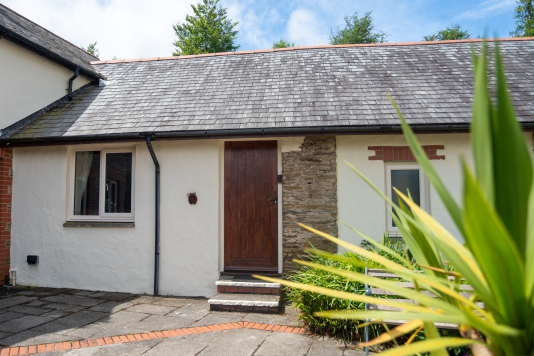 Charming stone-and-render cottage nestled within the peaceful grounds of Old Mill Cottages.