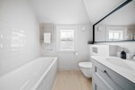 Cedar cottage - first floor family bathroom, with overhead shower and fold back glass bespoke shower door.  Great for using as a shower or as a bath as the screen moves.  heated mirror and vanity unit. Storage in drawers and also as you enter the bathroom. 