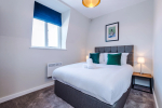 A cosy bedroom featuring a comfortable double bed, perfect for restful nights and relaxing stays.