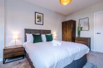 Comfortable bedroom with a king-size zip and link bed that can be separated into two singles upon request.