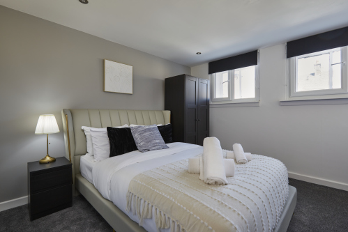 A bright and comfortable double bedroom , perfect for rest after a day of exploring.