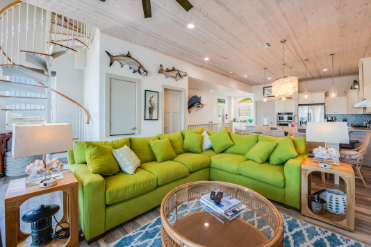 Living room has 6-person sectional sofa and 2 recliners