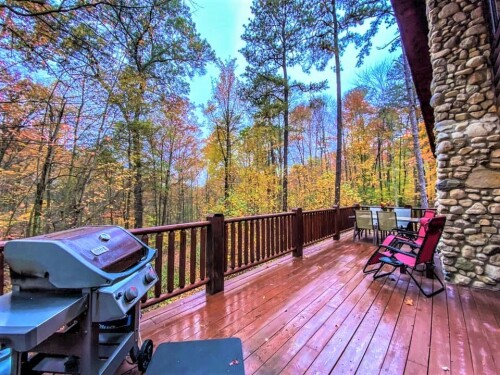 Wraparound decking, Covered porches, and a large balcony wrap the cabin in breathtaking beauty.