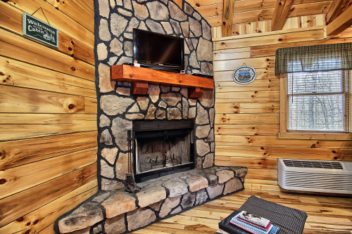 Closeup of Wood - Burning Fireplace and TV Screen (No TV access. Bring DVD's), Whispering Pines 