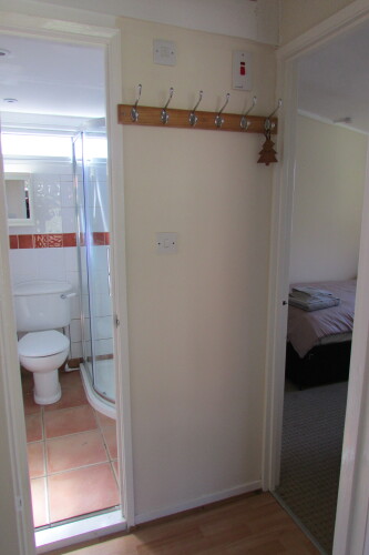 The hallway and shower room showing the twin room