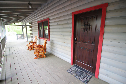 Front Door and Cedar Gliders, front Porch, Looking toward left, Rustic Cedar Inn 
