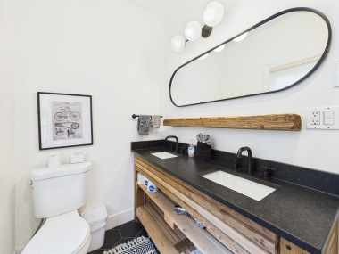 Natural wood, modern fixtures, and a clean palette elevate your daily routine.